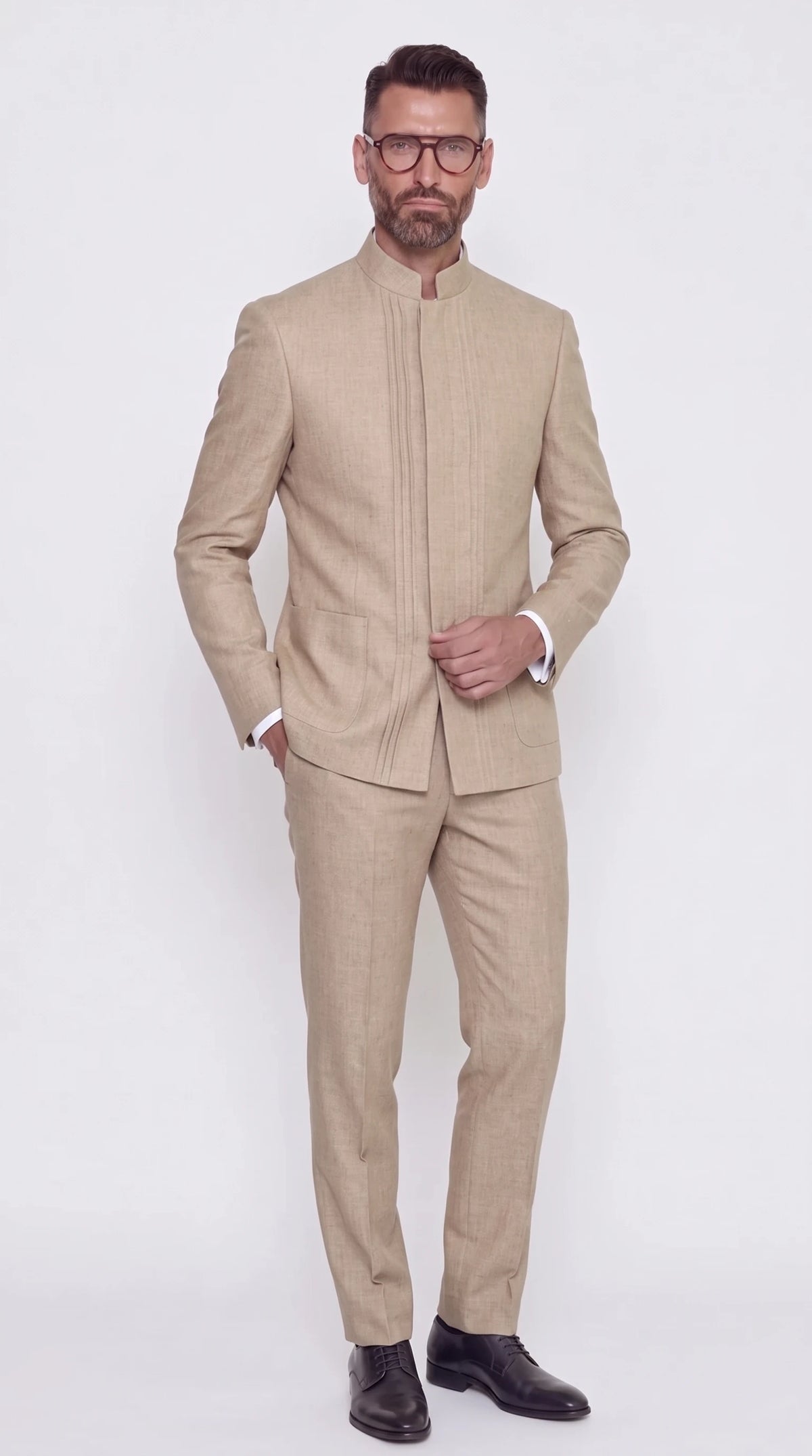 The Noir Pintuck Suit — Sand Pin-Tucked Mandarin Suit — front view, mandarin collar, pin-tucked concealed placket and patch pockets, Christopher Noir