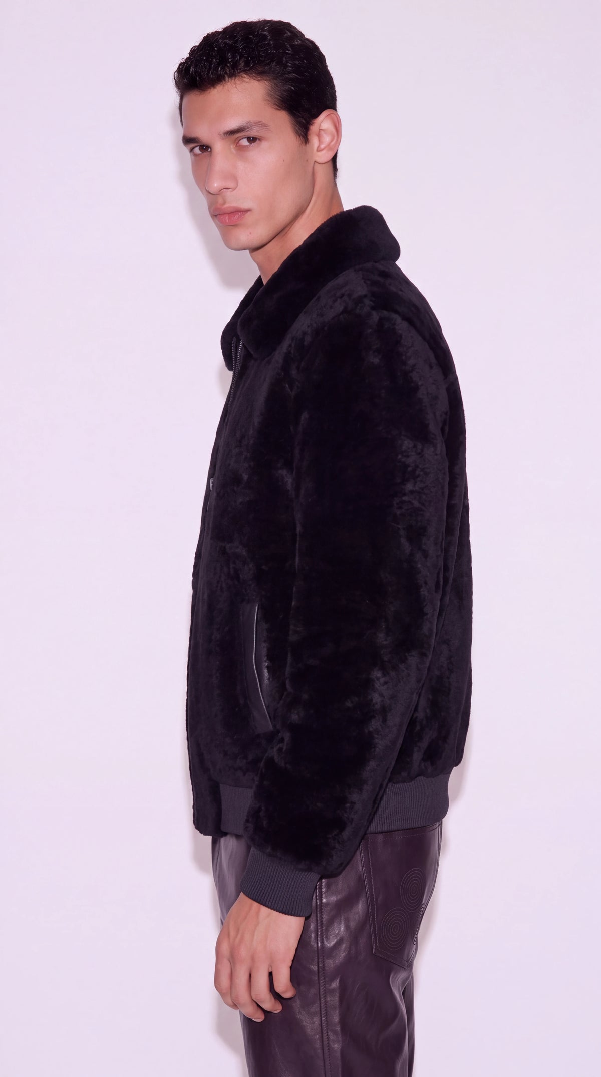 The Noir Greenwich black shearling bomber jacket by Christopher Noir, side view