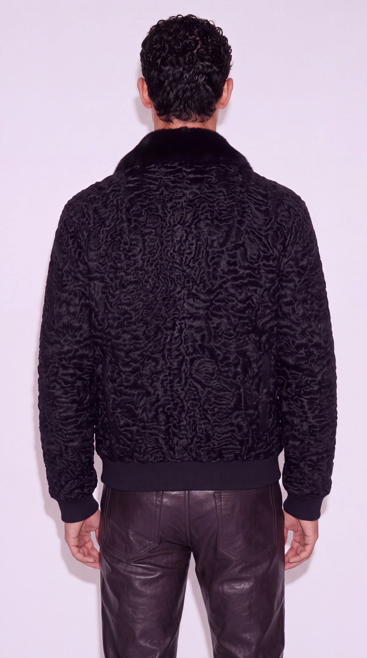 The Noir Westminster black astrakhan bomber jacket by Christopher Noir, back view