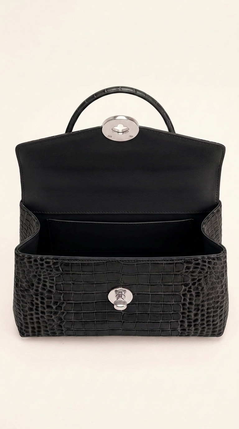 Kelvedon handbag in jet black, open interior showing slip pocket