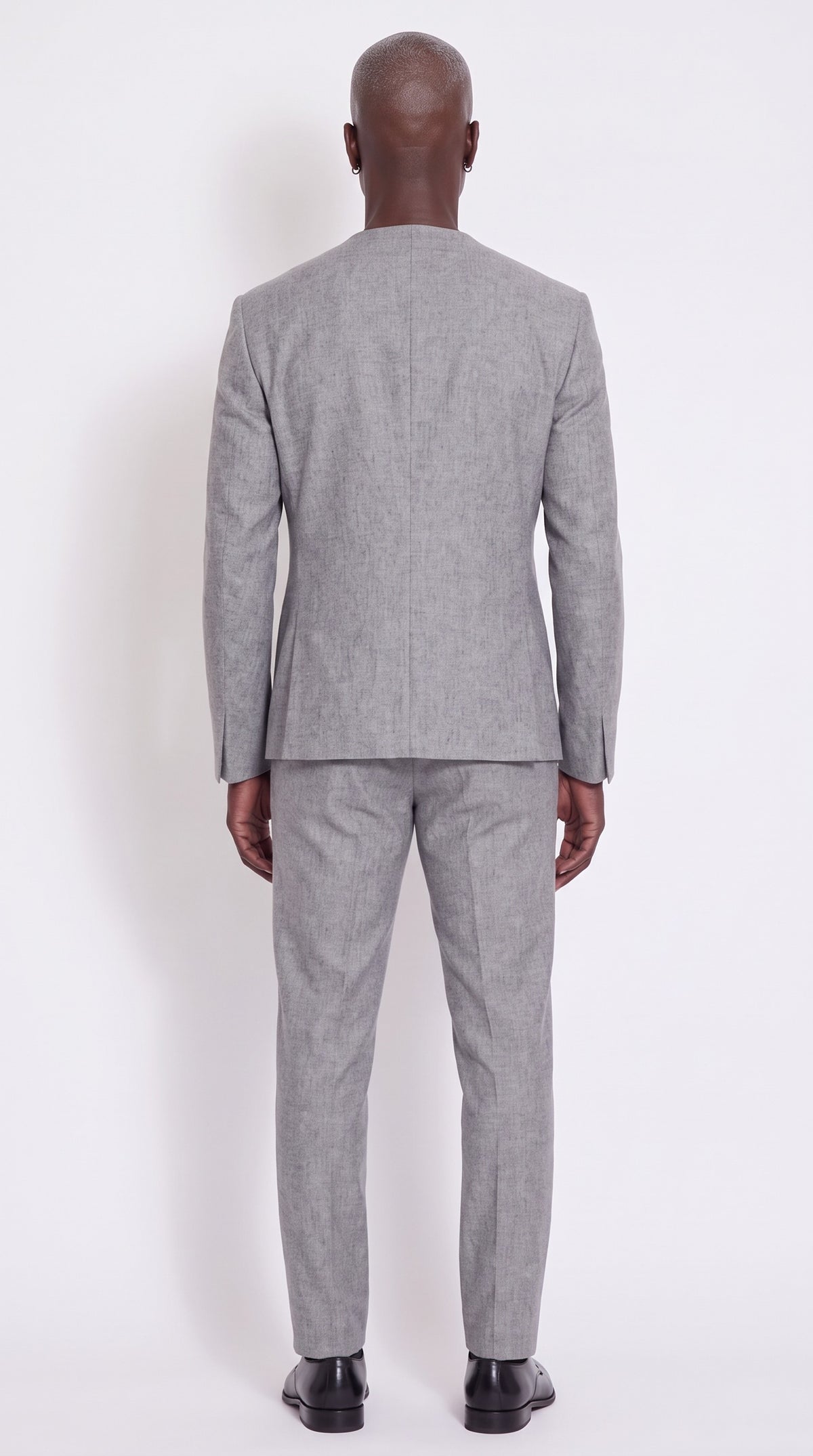 The Noir Ascent Guard Suit — Asymmetric Longline Suit – back view, Christopher Noir