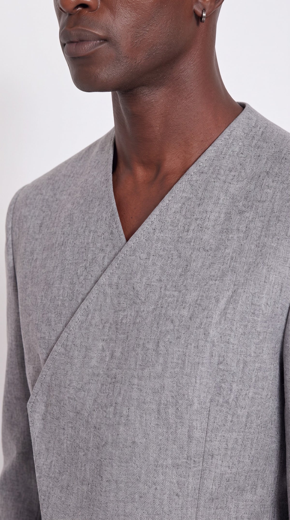 The Noir Ascent Guard Suit — Asymmetric Longline Suit – fabric and tailoring detail close-up, Christopher Noir