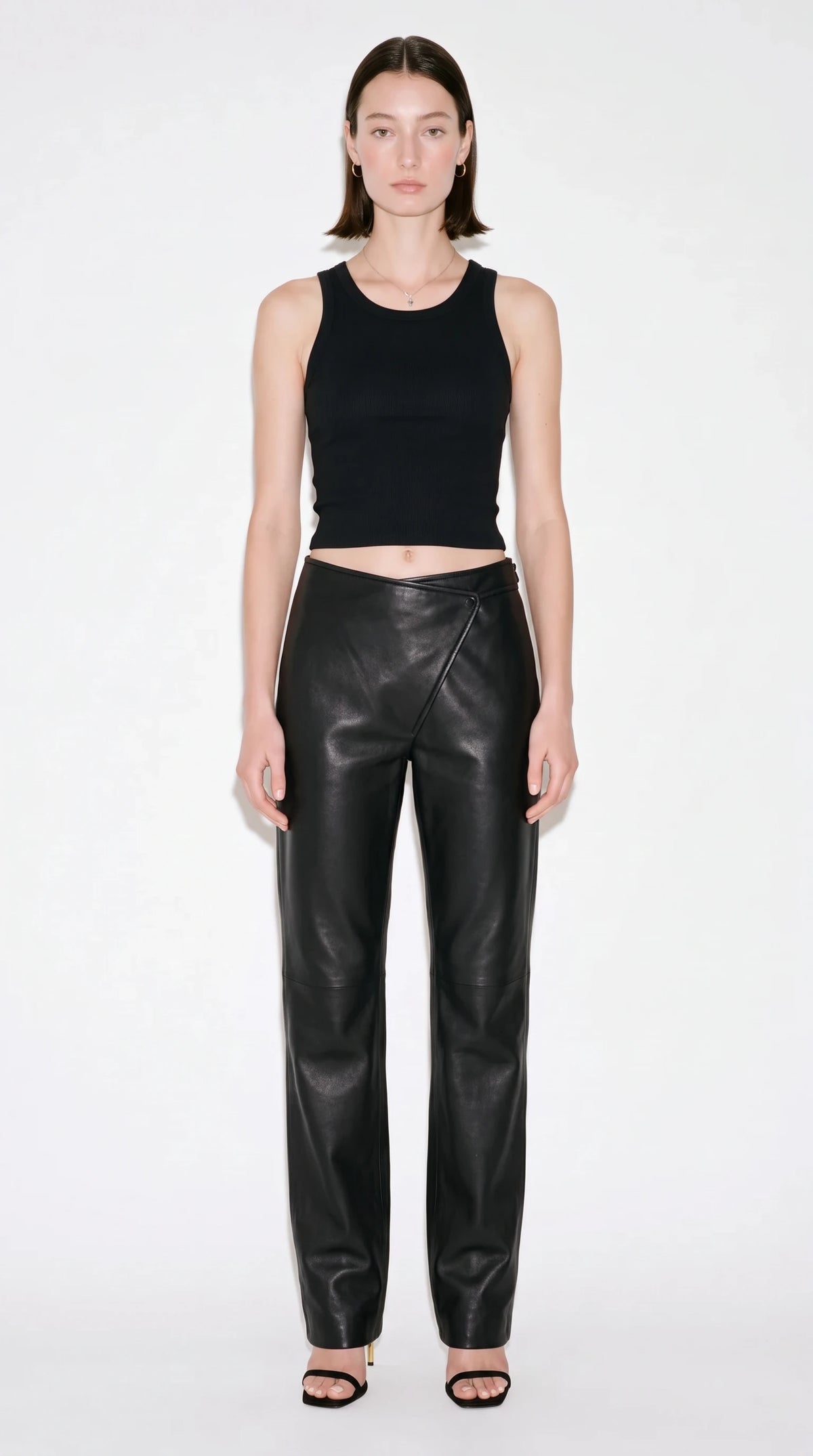 The Noir Bias asymmetric wrap-front leather trousers in jet black - CNOIR