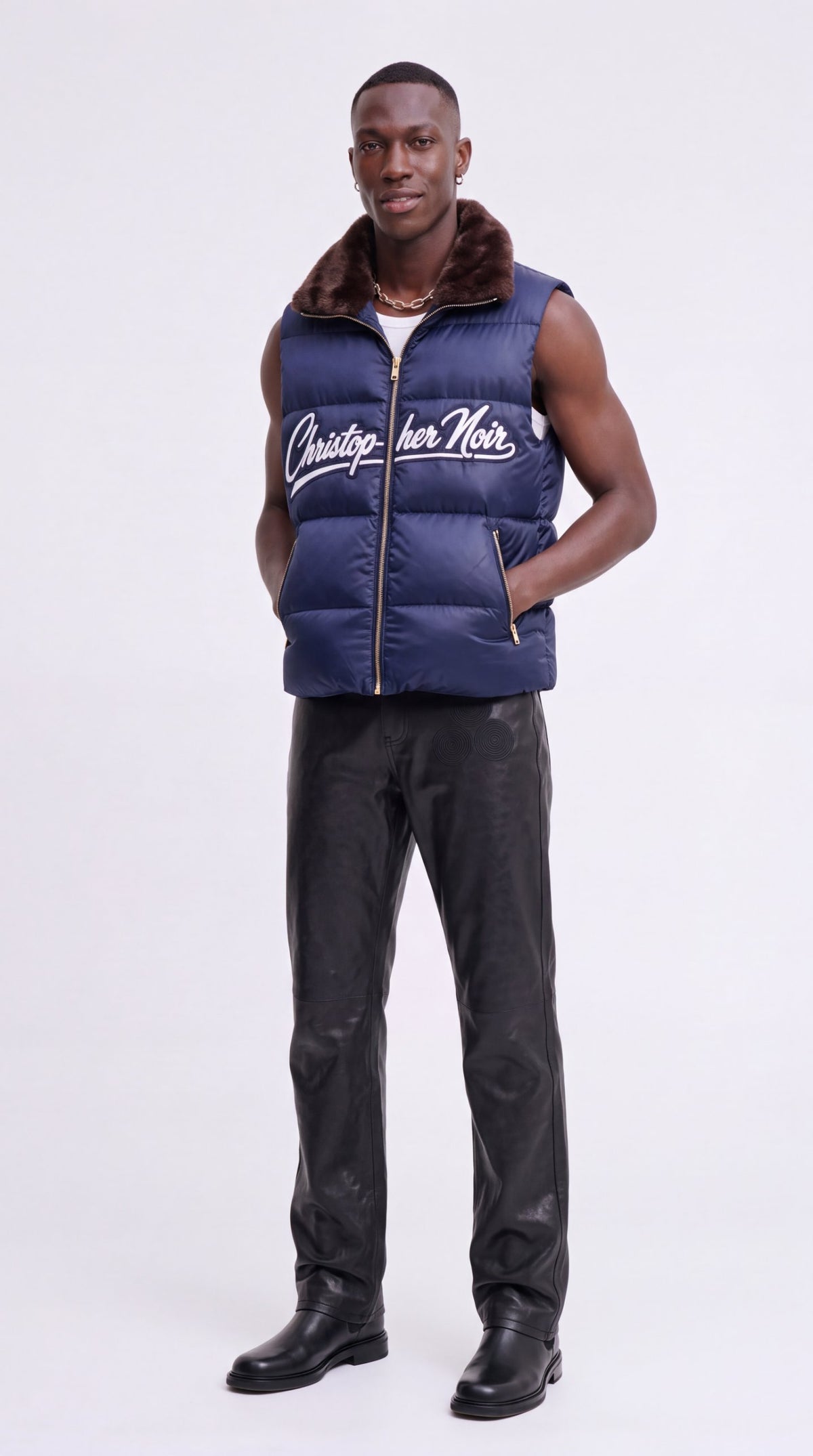 The Noir Bute navy faux-fur collar signature puffer gilet, full length, by Christopher Noir