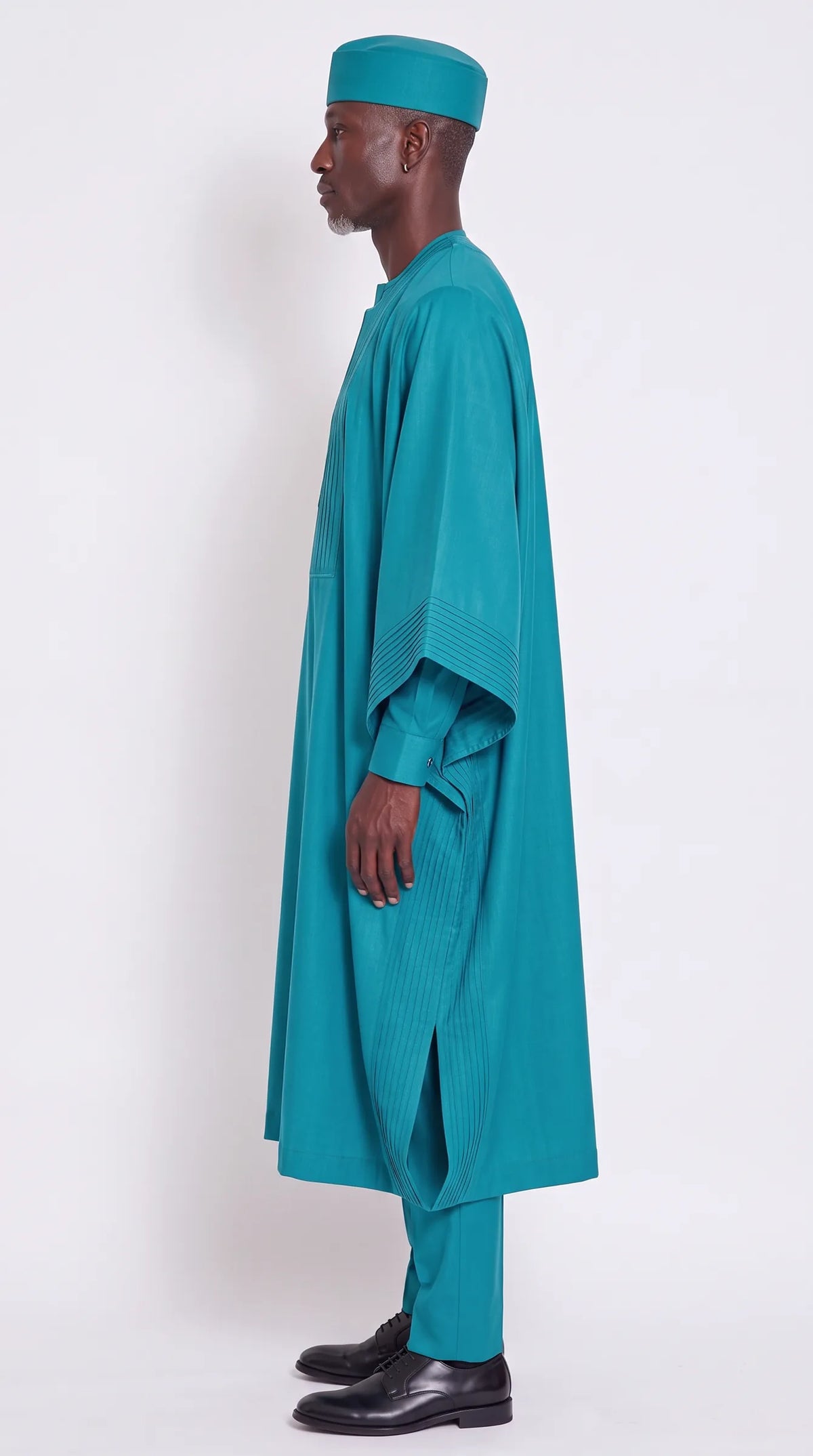 Noir Cascade Agbada — teal men's agbada set, side view showing the robe drape