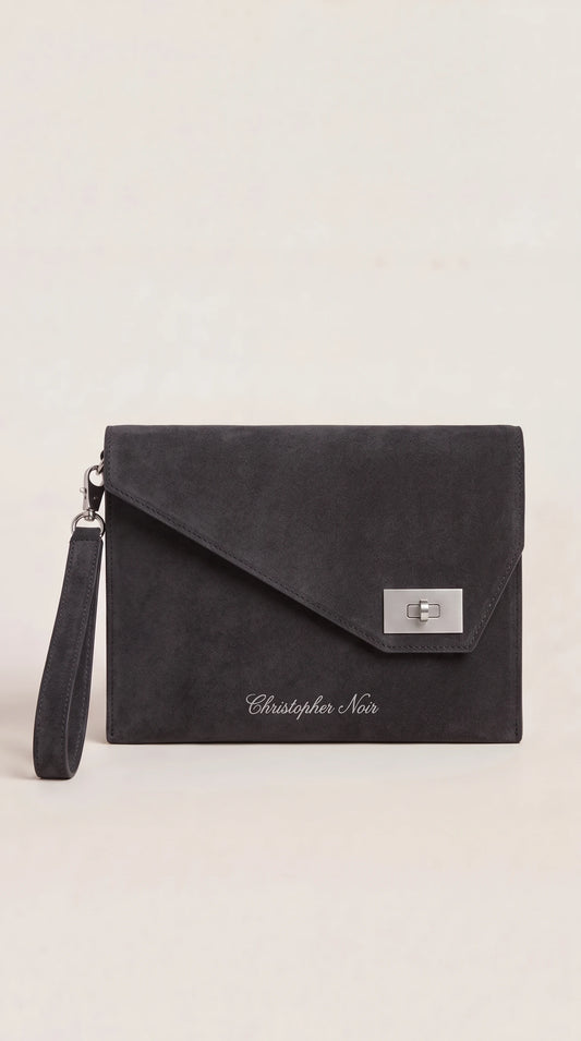 The Noir Corbridge charcoal suede-finish leather envelope clutch, front view with angled point flap and silver-tone turn-lock