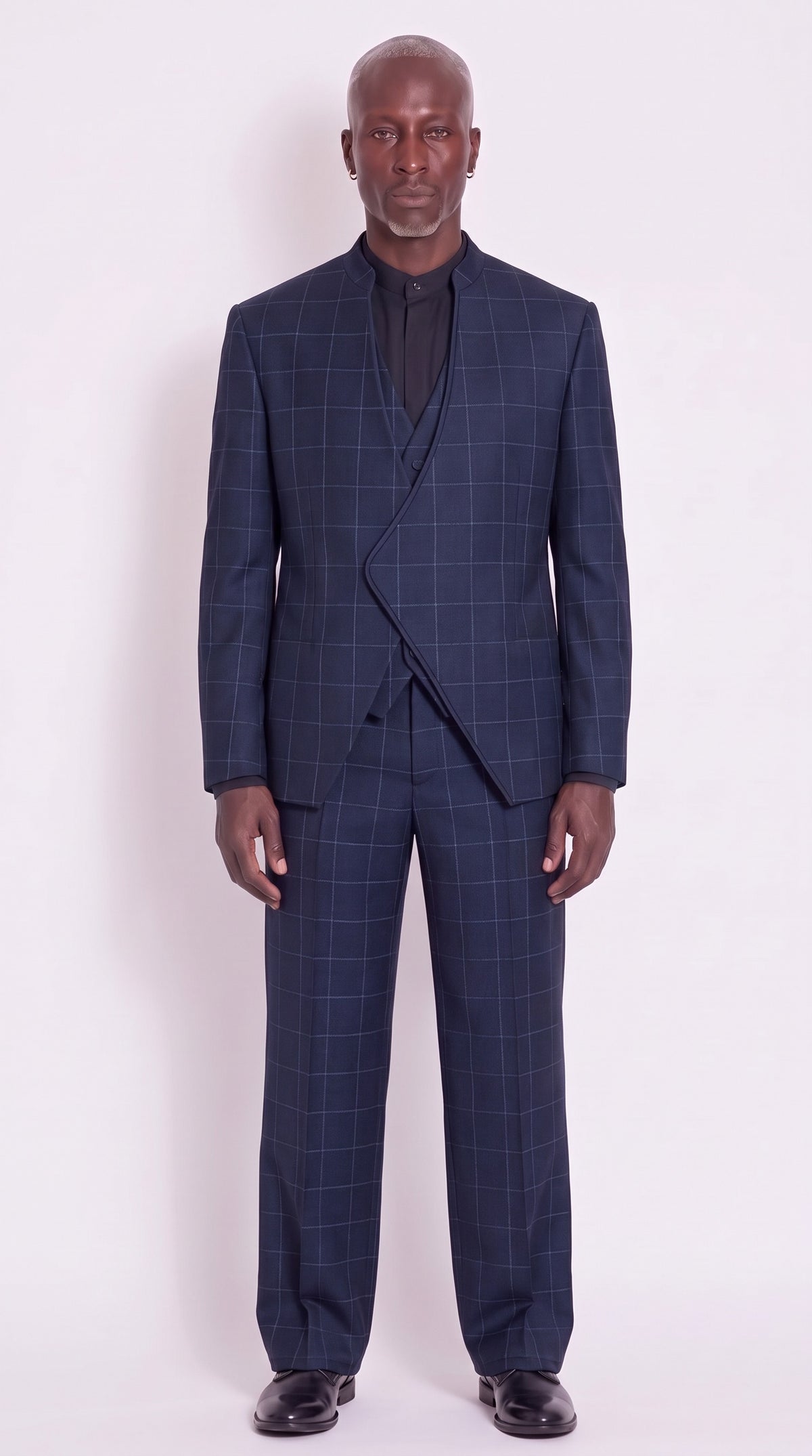The Noir Crescent Relaxed Suit — navy abstract-check three-piece, front view, Christopher Noir
