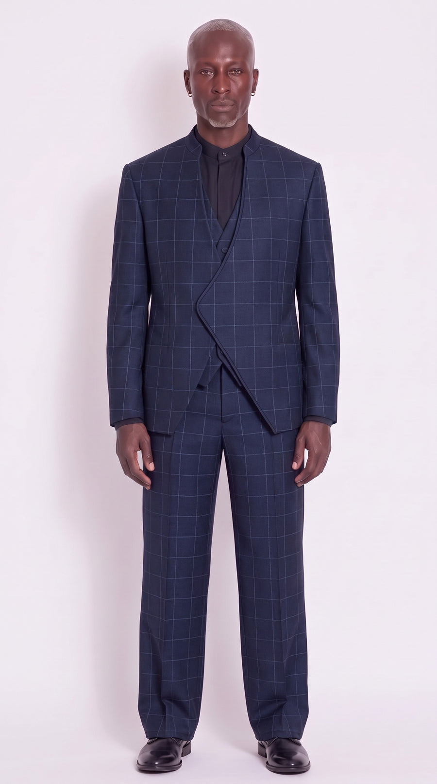 The Noir Crescent Relaxed Suit — navy abstract-check three-piece, front view, Christopher Noir