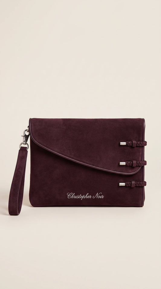The Noir Dunster aubergine suede-finish leather clutch, front view with three braided leather loop fastenings and detachable wrist strap