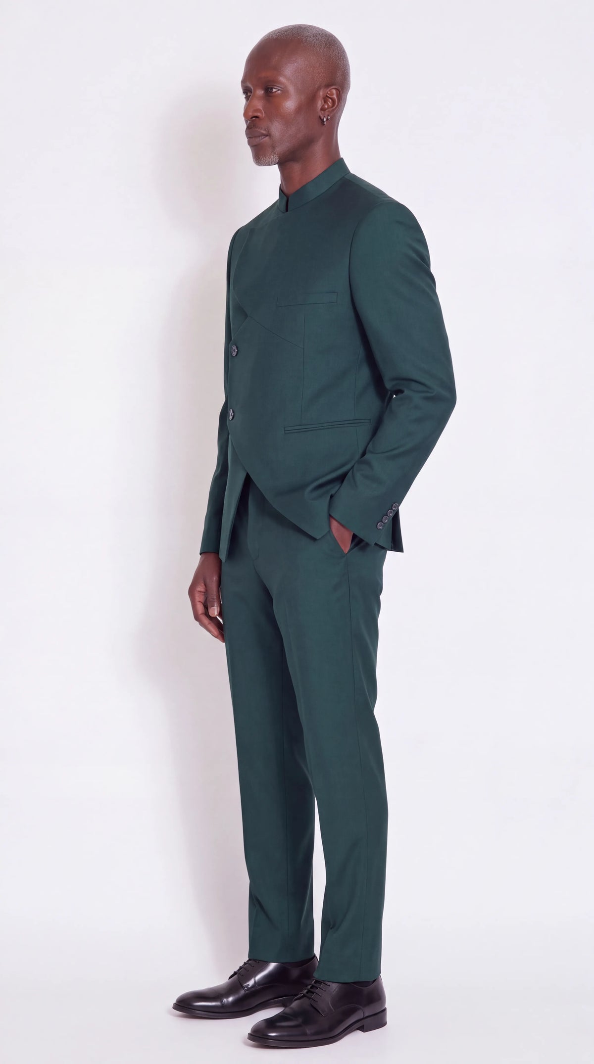 The Noir Echelon Suit — Green Angular-Panel Suit — three-quarter view