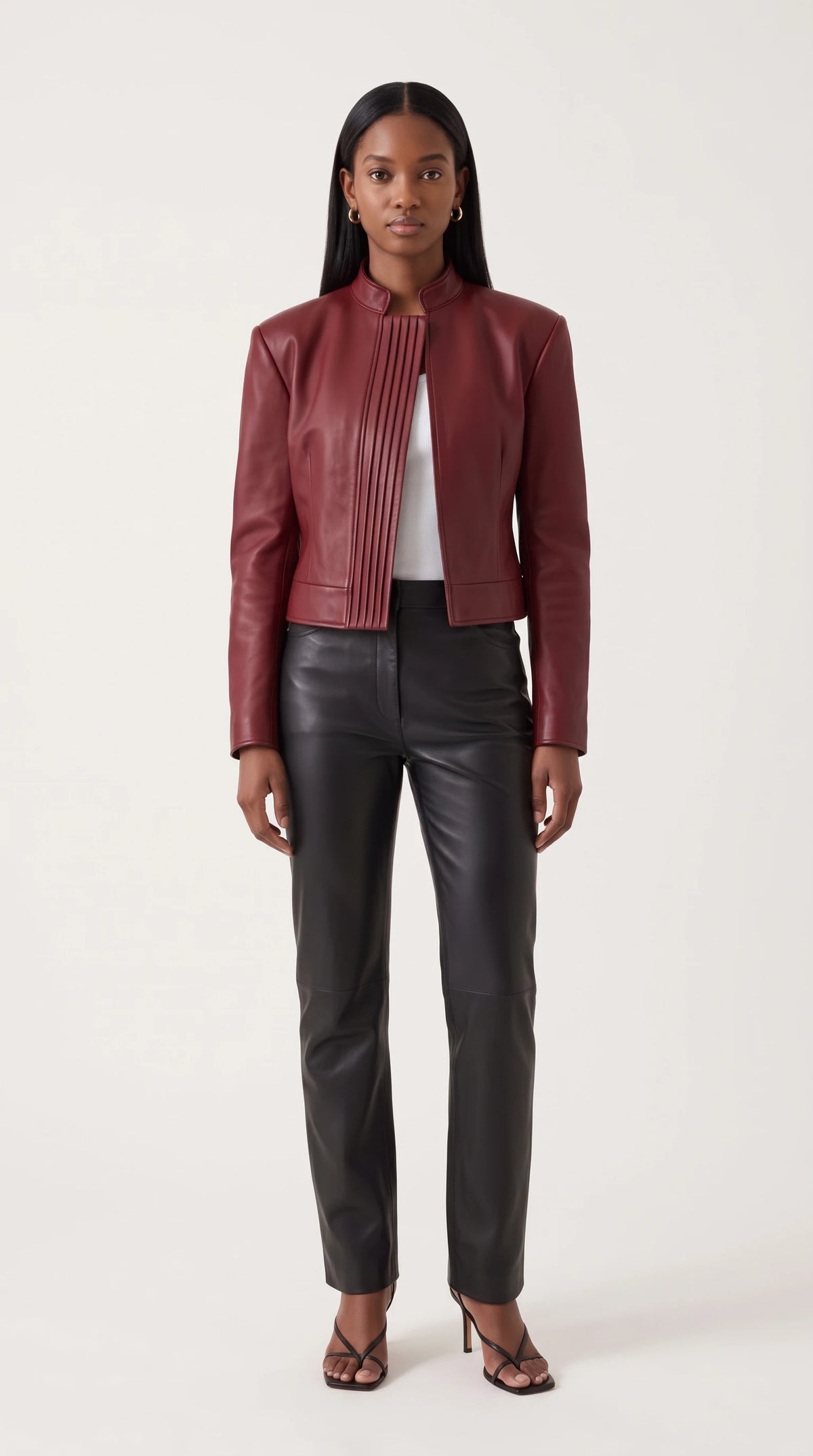 The Noir Egilsay cropped oxblood leather jacket with stand collar and pin-tuck pleated front panel