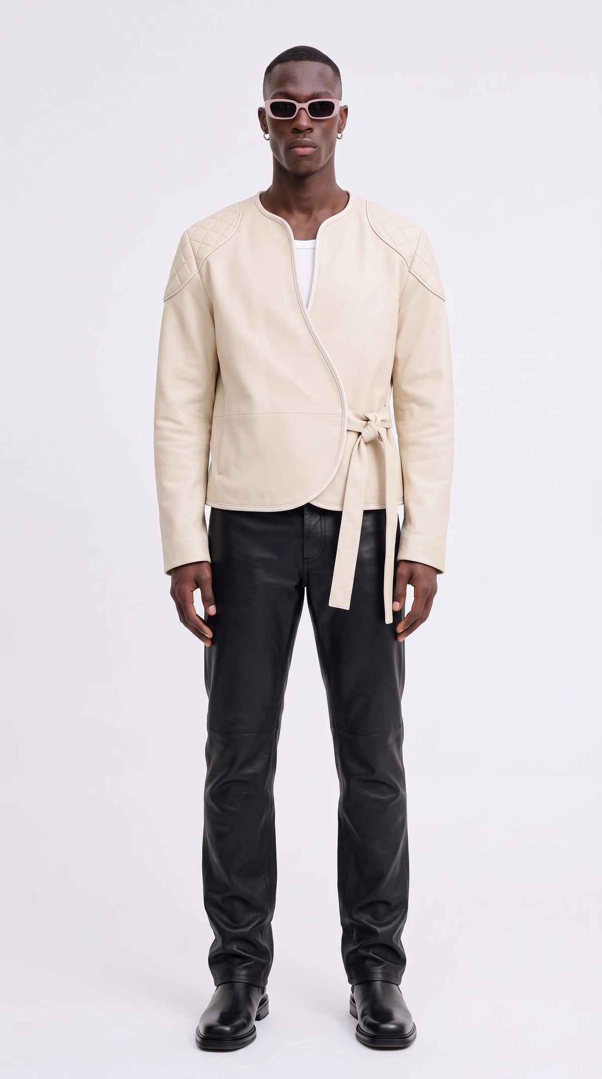 The Noir Foula ivory leather wrap jacket with diamond-quilted shoulders and side tie belt