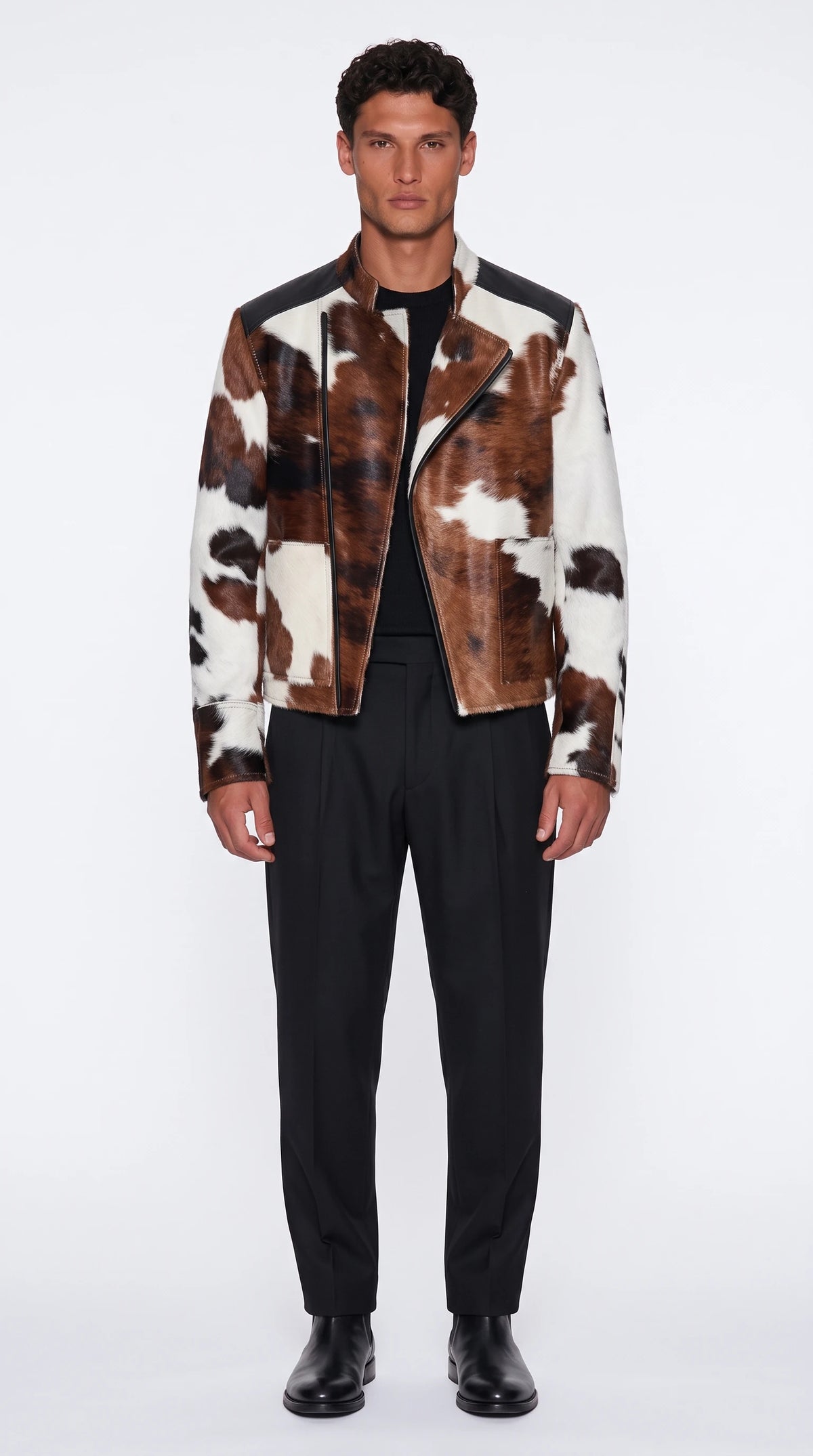 The Noir Hoy hair-on cowhide biker jacket in brown and white with black leather shoulder yokes, front view