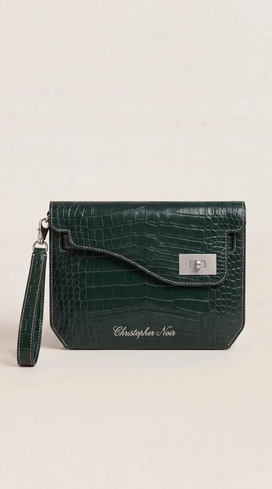 The Noir Kelmscott forest green croc-effect leather clutch, front view with contrast cream saddle stitching and silver-tone turn-lock