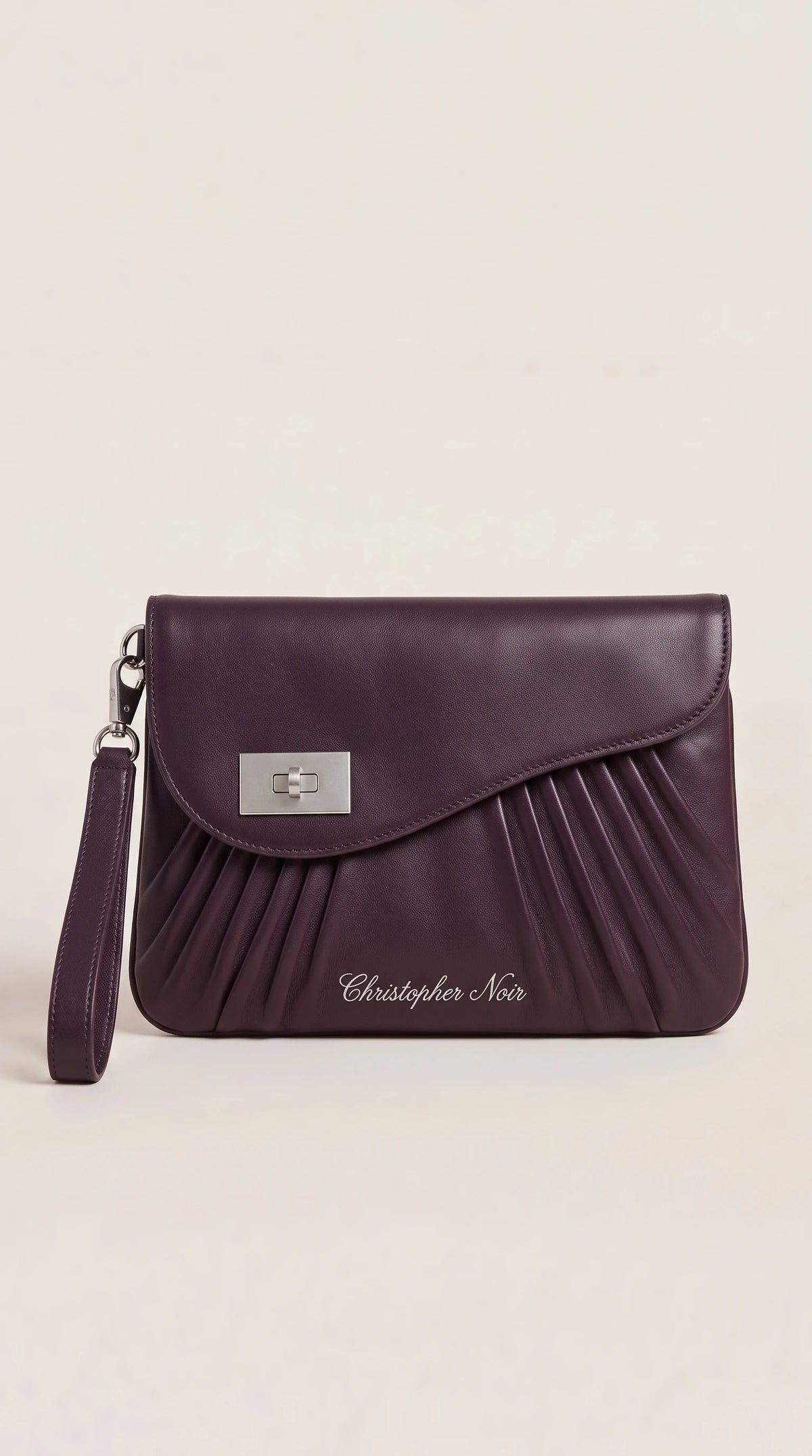 The Noir Lyndhurst aubergine pleated-front leather wristlet clutch, front view with curved flap and silver-tone turn-lock