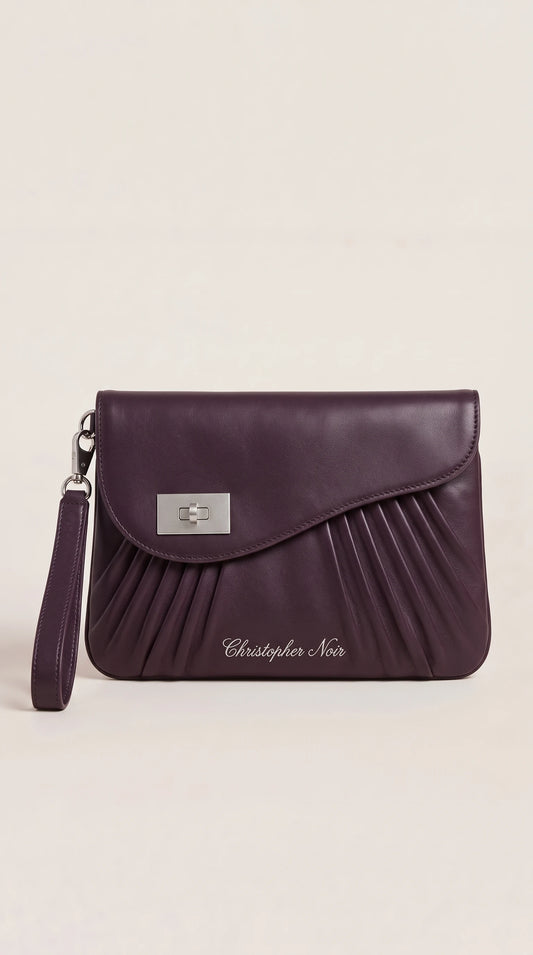 The Noir Lyndhurst aubergine pleated-front leather wristlet clutch, front view with curved flap and silver-tone turn-lock