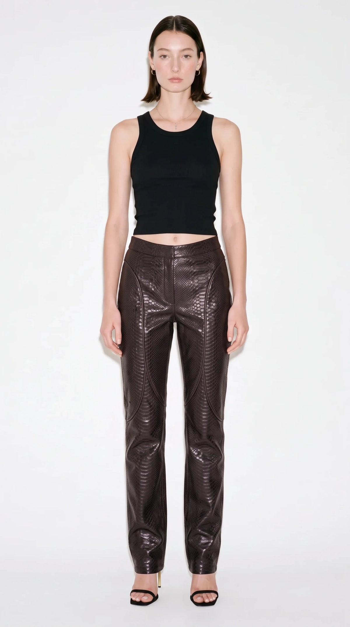 The Noir Meander curved-panel leather trousers in chocolate brown python-embossed leather - CNOIR
