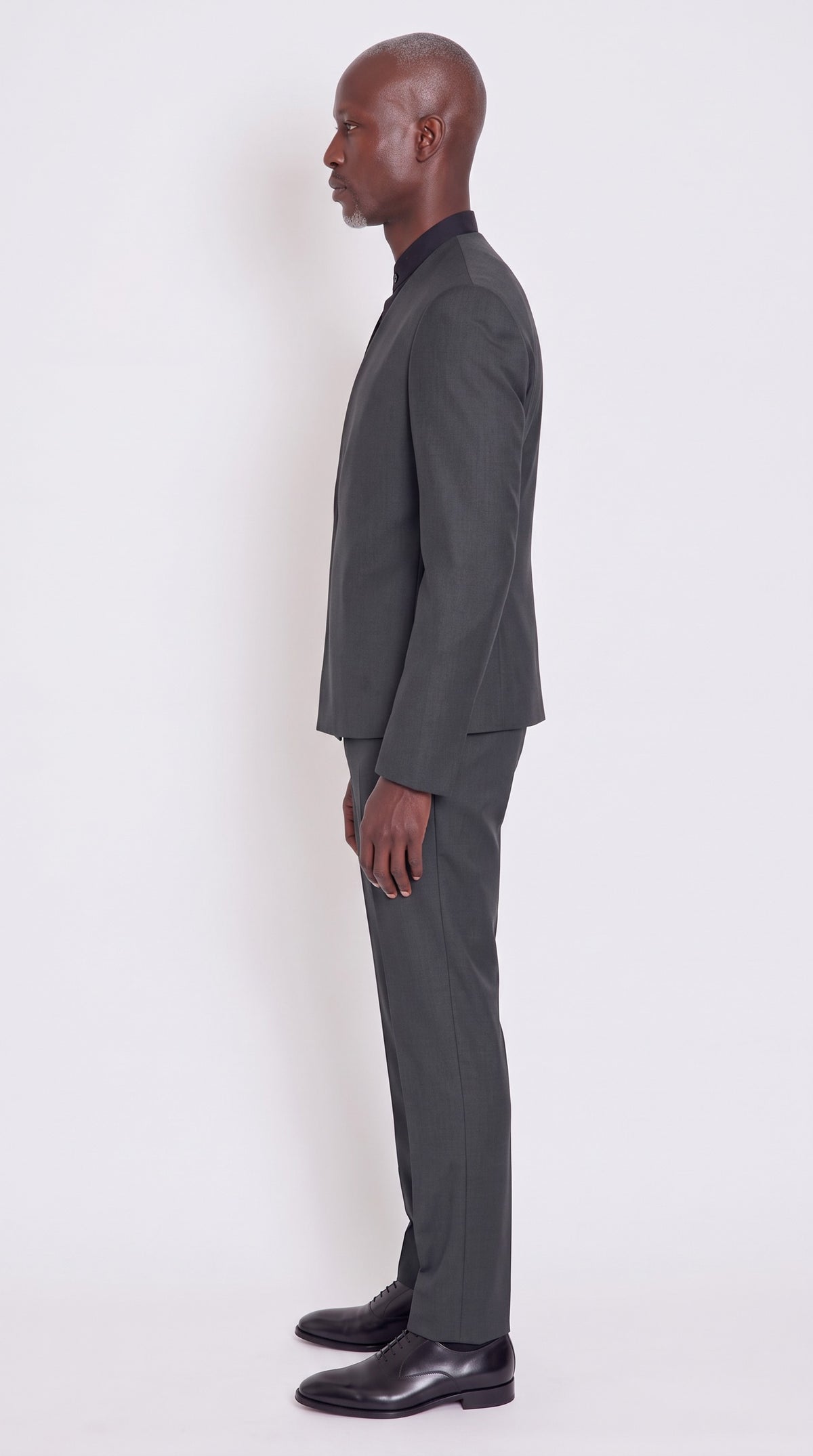 The Noir Obsidian Suit — Black Wrap-Front Suit – side profile view, Christopher Noir