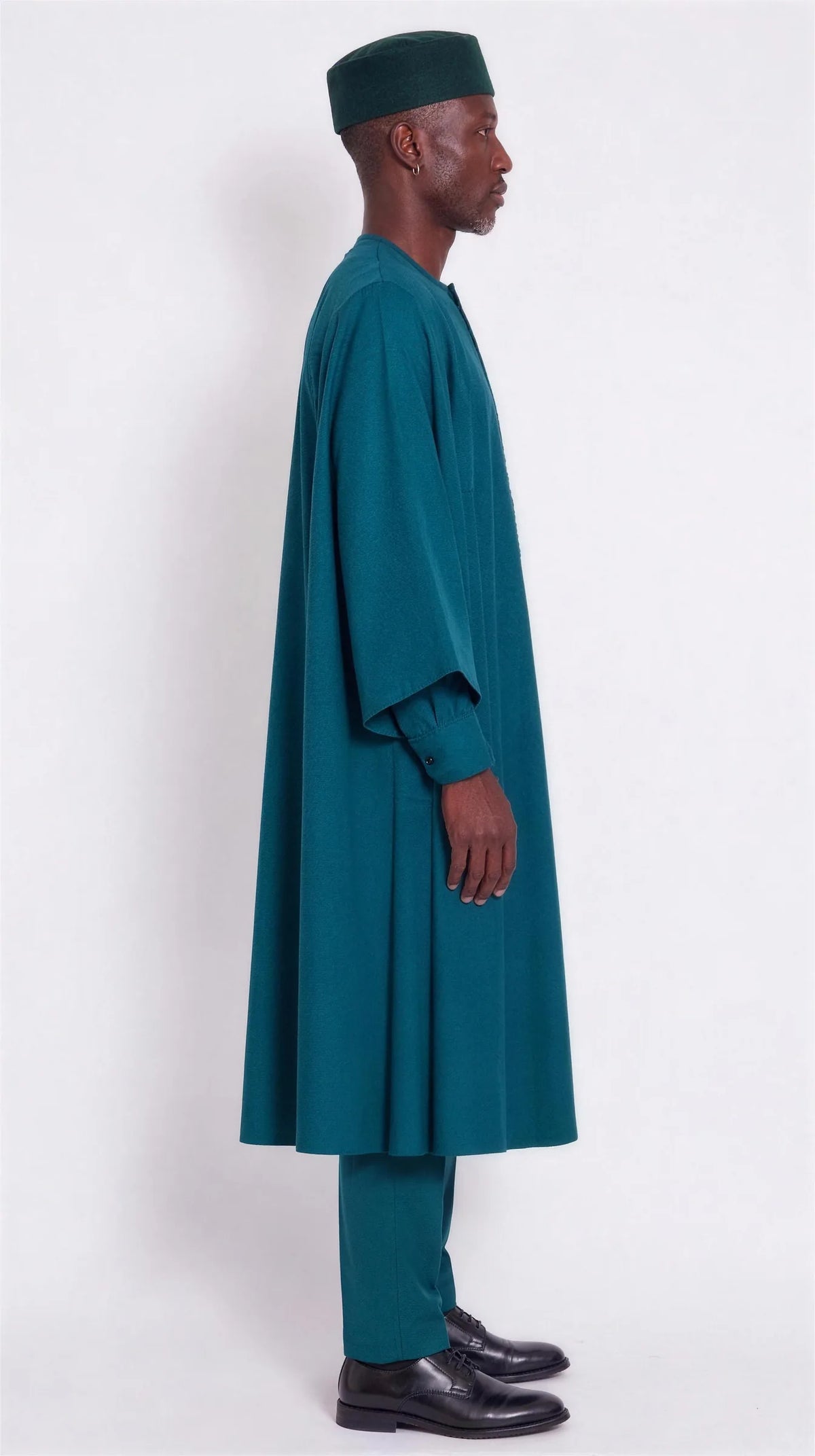 Noir Peacock Agbada — deep teal men's agbada set, side view showing the robe drape