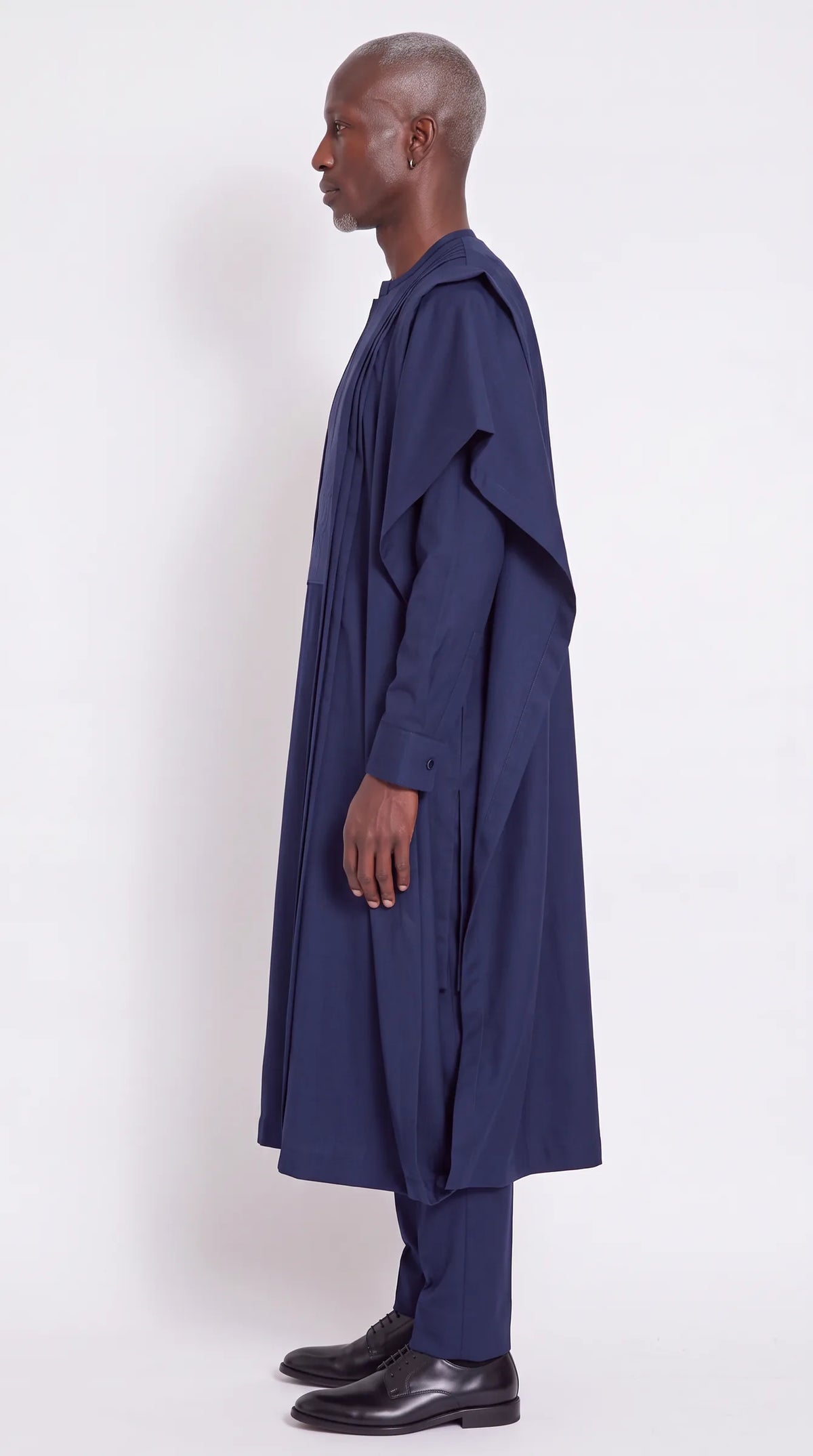 Noir Sovereign Agbada — navy men's agbada set, side view showing the robe drape