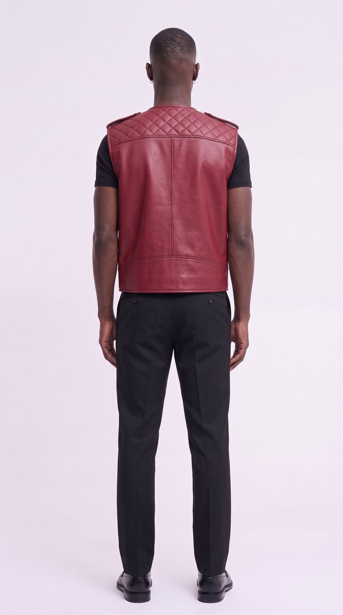 Back view of the crimson leather gilet with diamond-quilted yoke