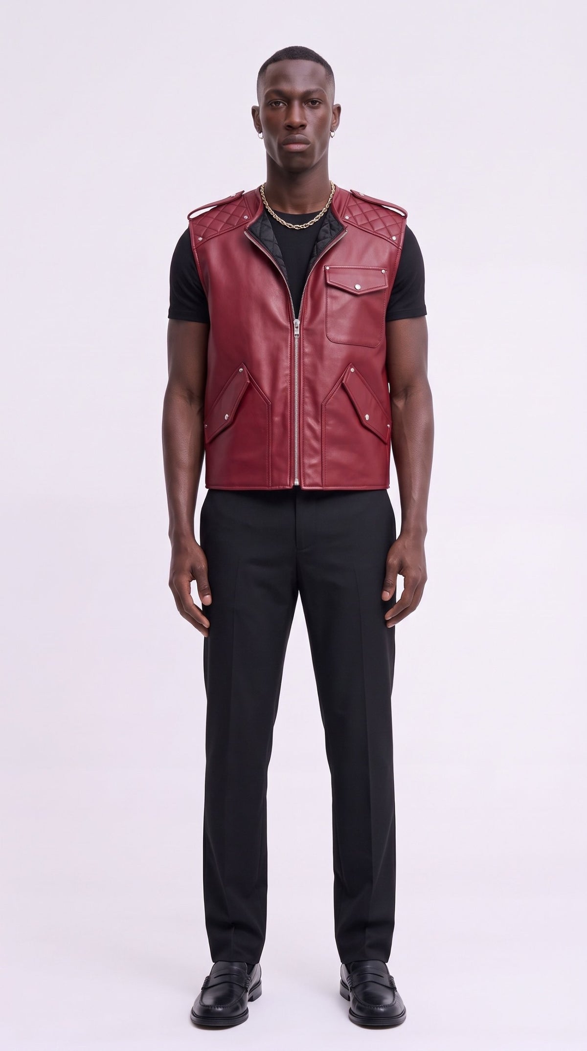 Model wearing the crimson leather gilet over a black tee with black tailored trousers
