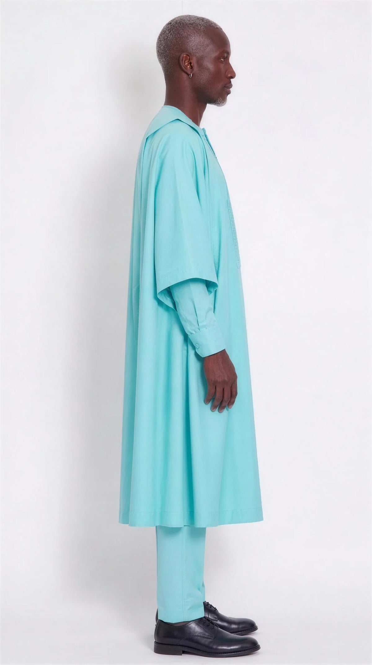 Noir Tide Agbada — aqua men's agbada set, side view showing the robe drape