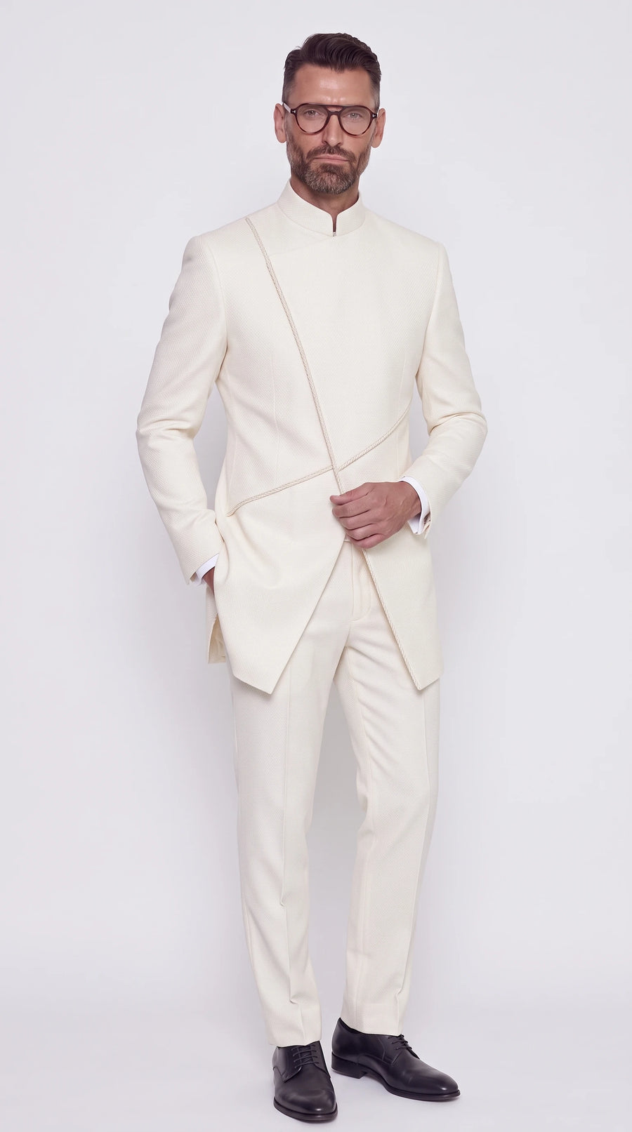 The Noir Twin Blade Suit — Ivory Corded Crossover Suit — front view, mandarin collar and twin crossing cords on an asymmetric front, Christopher Noir