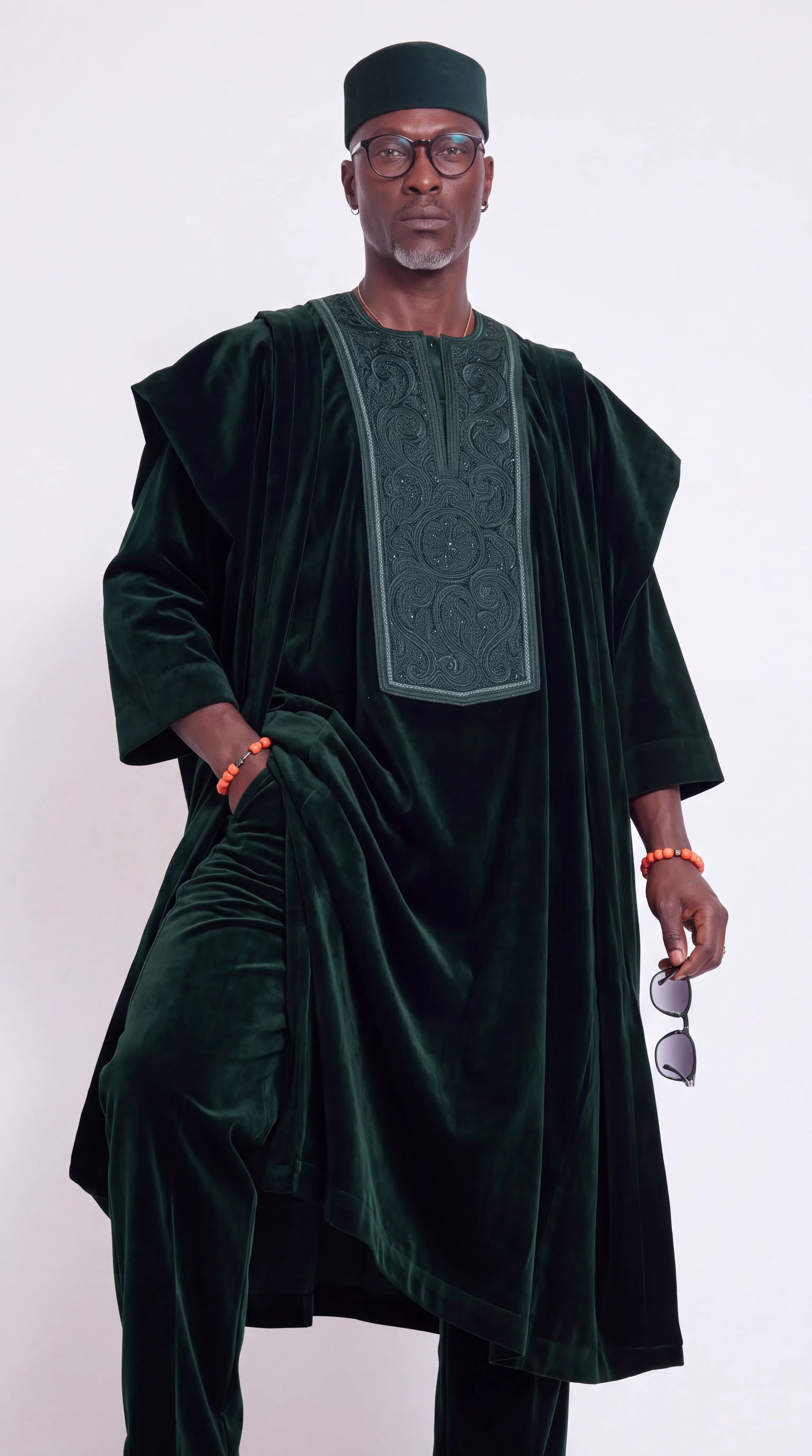 Noir Verdure Agbada — emerald green agbada robe with matching trousers, walking view