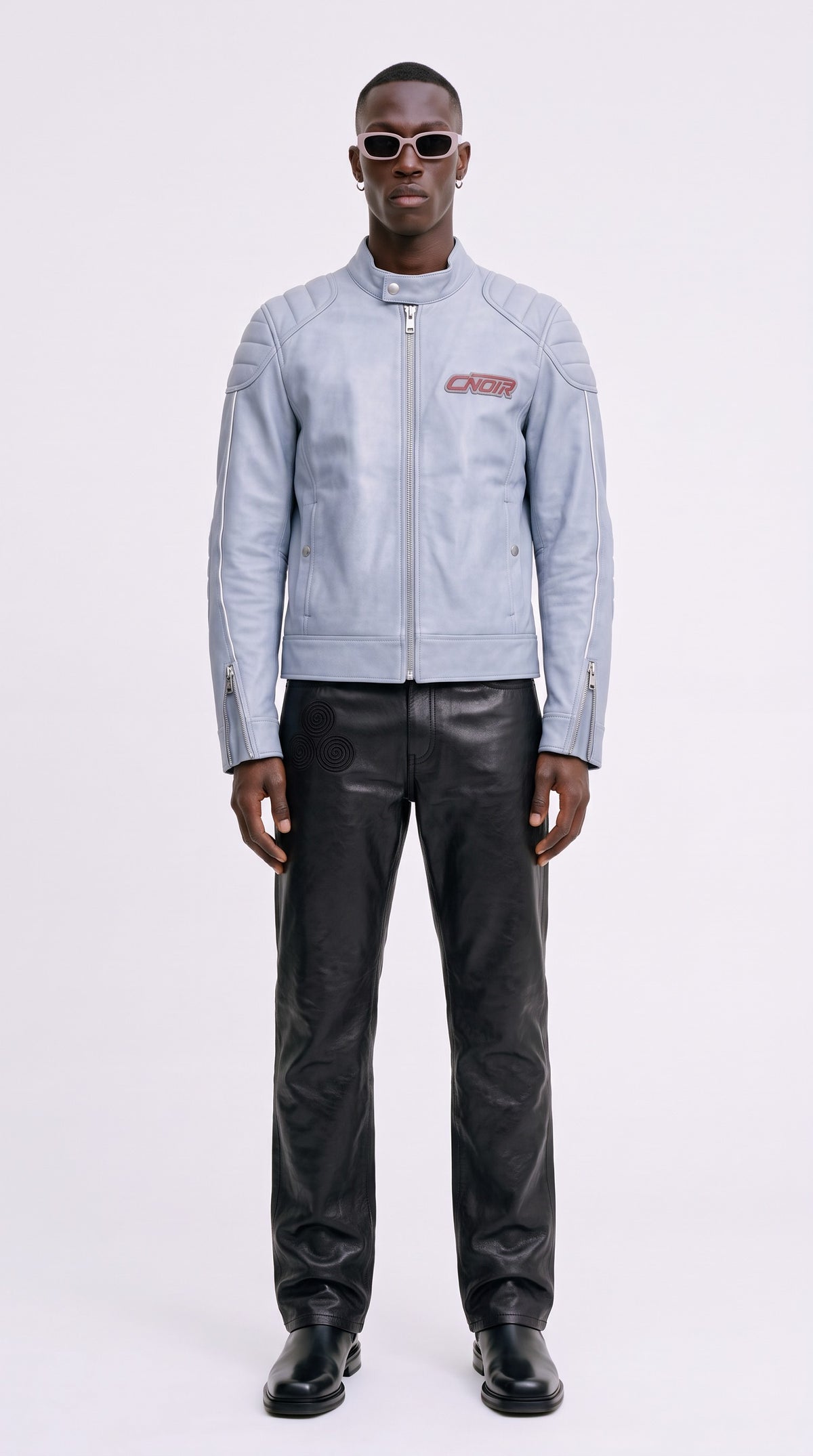 The Noir Powder Blue Racer — Padded Racer Jacket (Unisex) – on model with black leather jeans, Christopher Noir