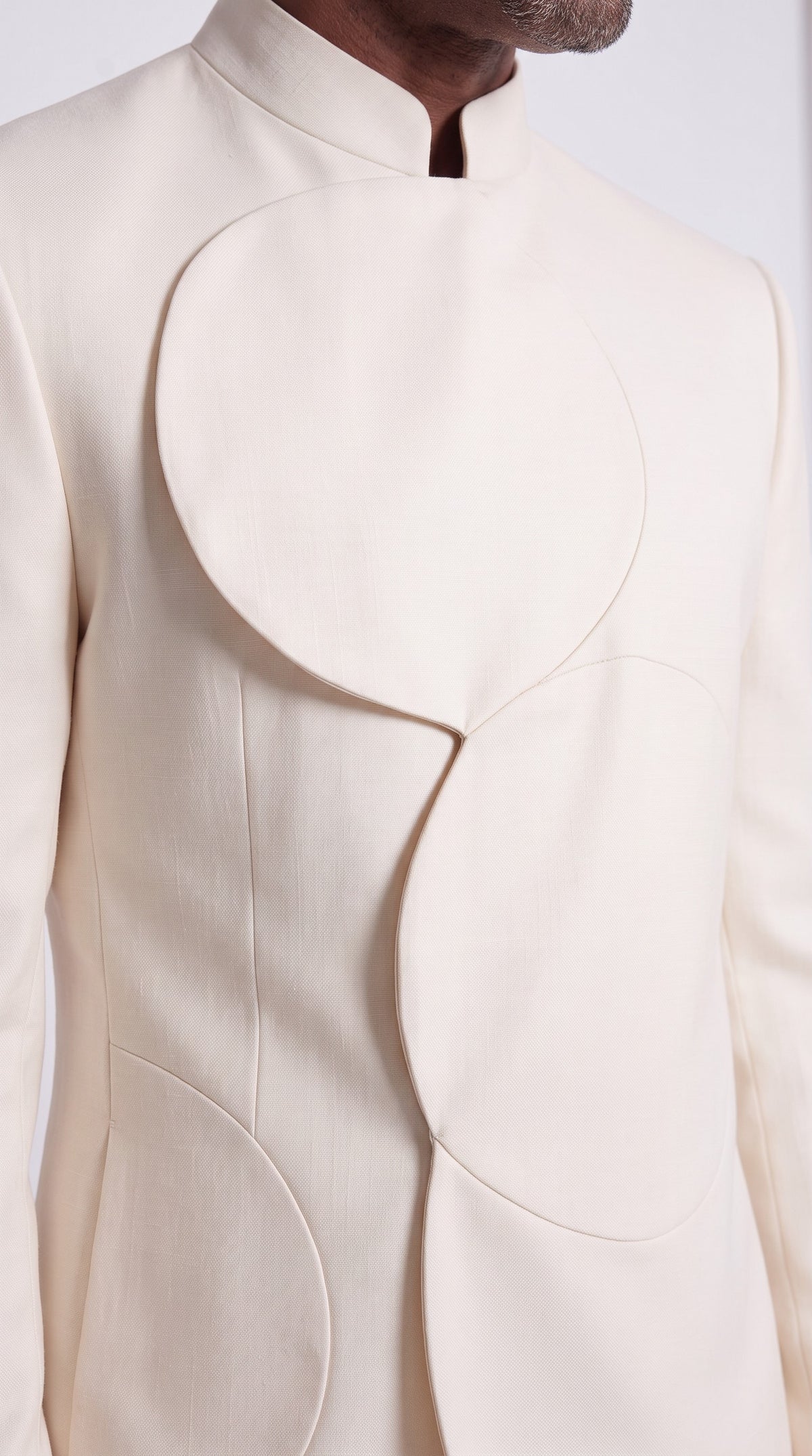 The Noir Arc Suit — Ivory Curved-Panel Suit – fabric and tailoring detail close-up, Christopher Noir