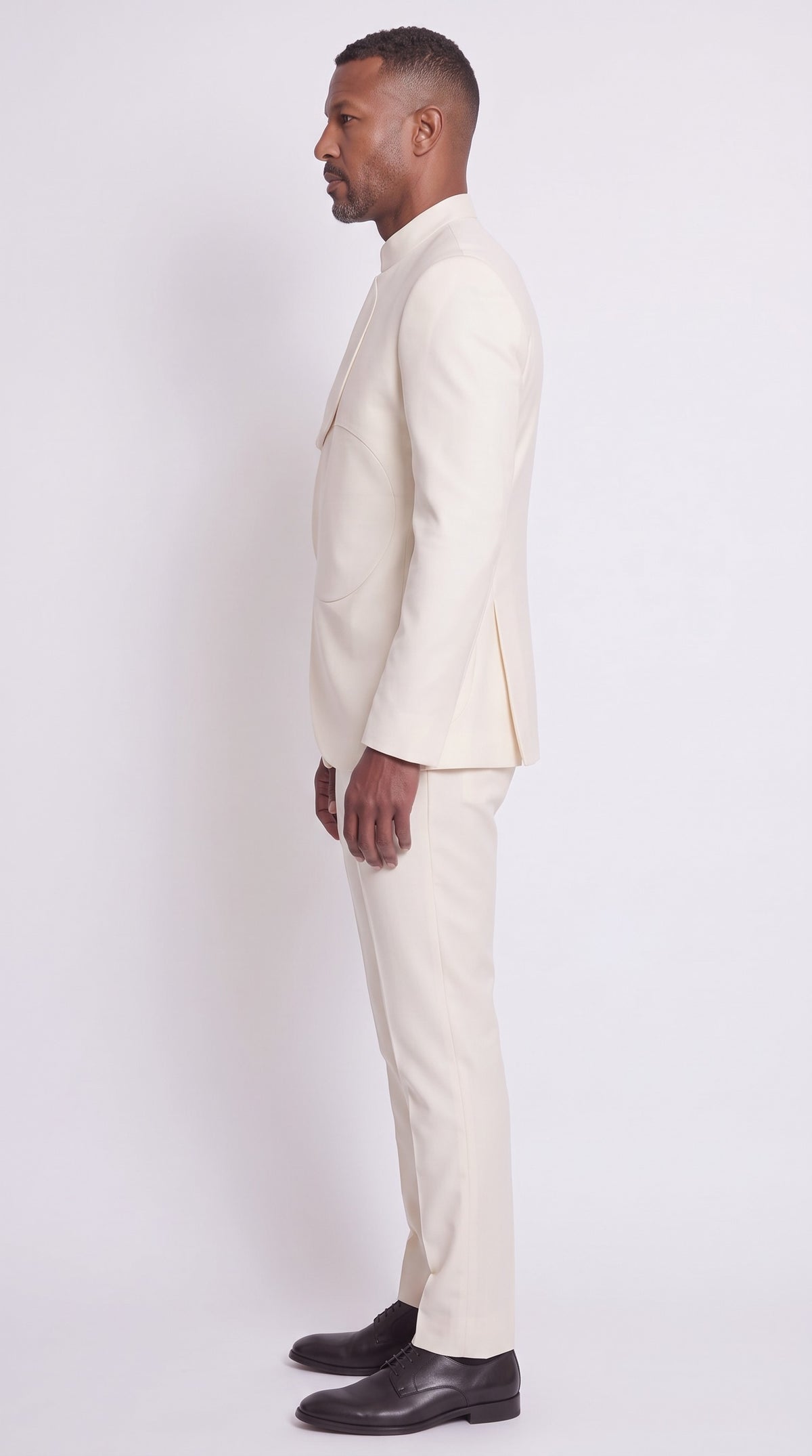 The Noir Arc Suit — Ivory Curved-Panel Suit – side profile view, Christopher Noir
