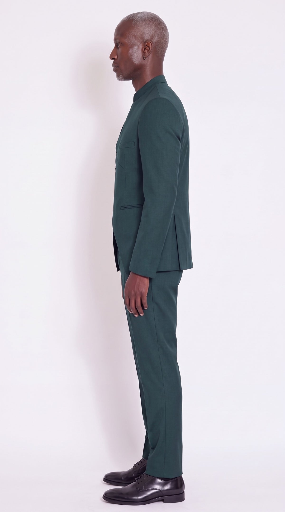 The Noir Asymmetra II Suit — Green Angular-Panel Suit – side profile view, Christopher Noir