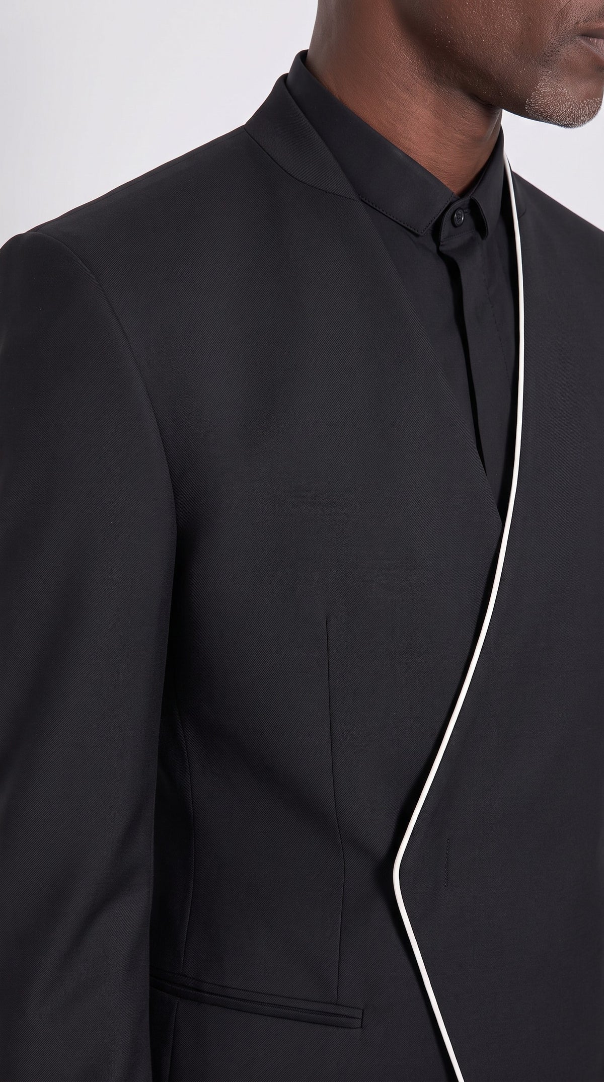 The Noir Blade Suit — Collarless Diagonal Suit – fabric and tailoring detail close-up, Christopher Noir