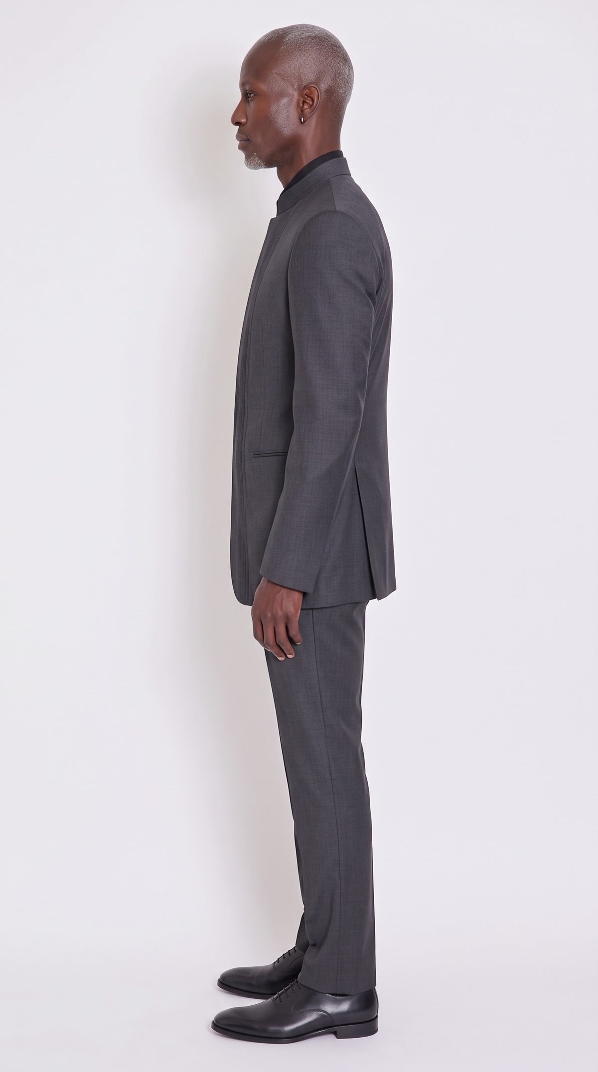 The Noir Cadence Suit — Knife-Pleat Mandarin Suit – side profile view, Christopher Noir