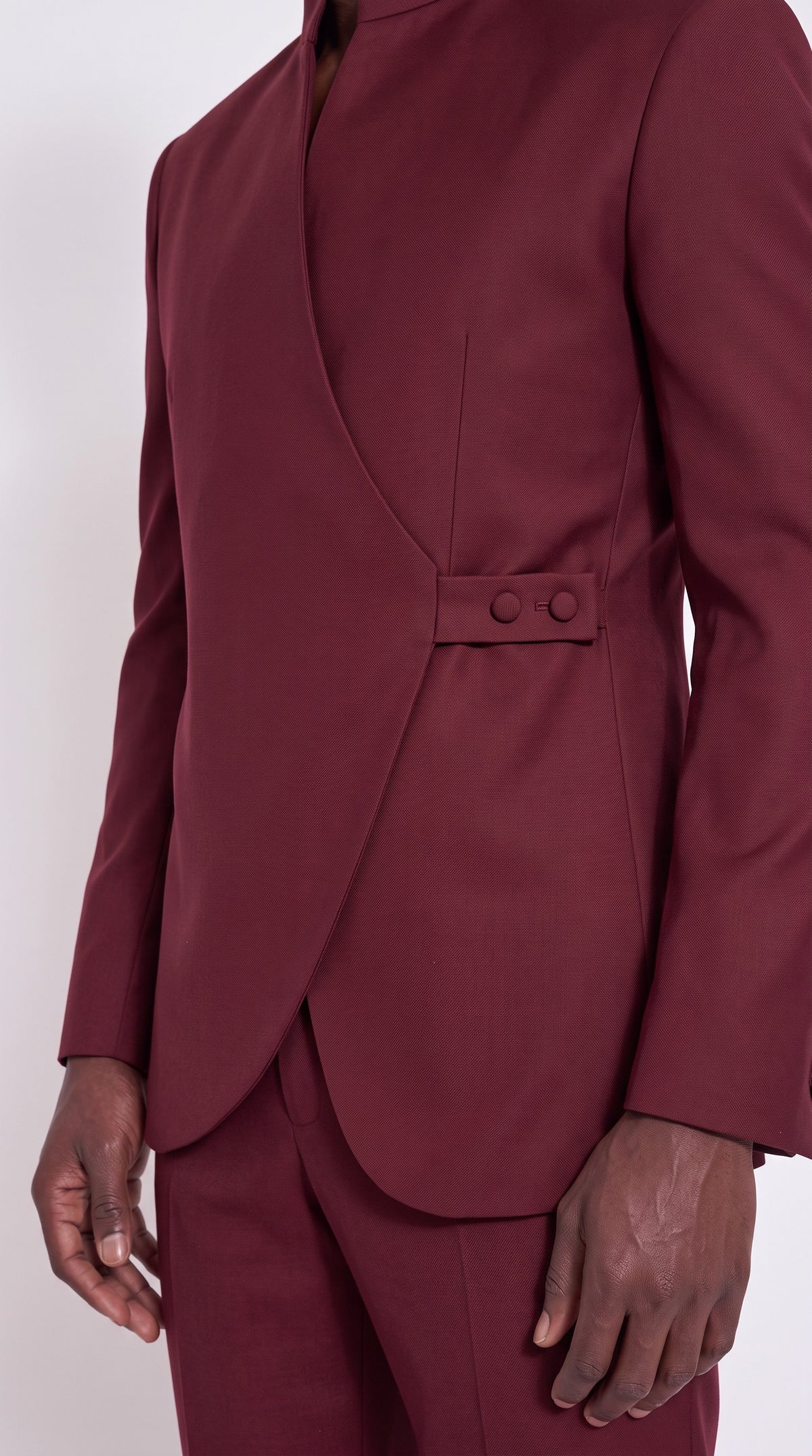 The Noir Crest Suit — Burgundy Tab-Fastened Wrap Suit – fabric and tailoring detail close-up, Christopher Noir