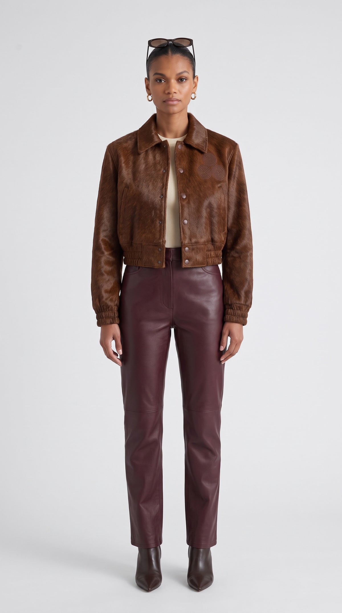 The Noir Taransay — Cognac Hair-On Calf Cropped Bomber Jacket – on model, Christopher Noir
